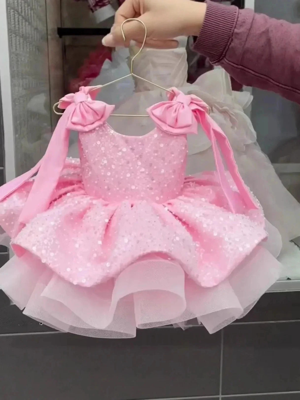 Showlu Smart General pink flower girls dress with sleeveless design, bow accents, sequins, puffy style for weddings and parties.