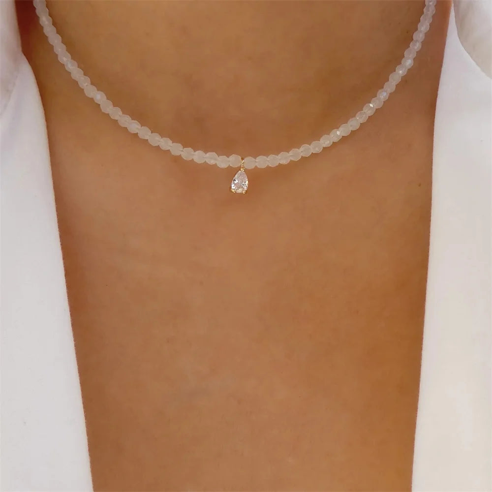 Elegant vintage pearl pendant necklace for women, gold-tone multi-layer chain choker with round pendant, fashionable jewelry.