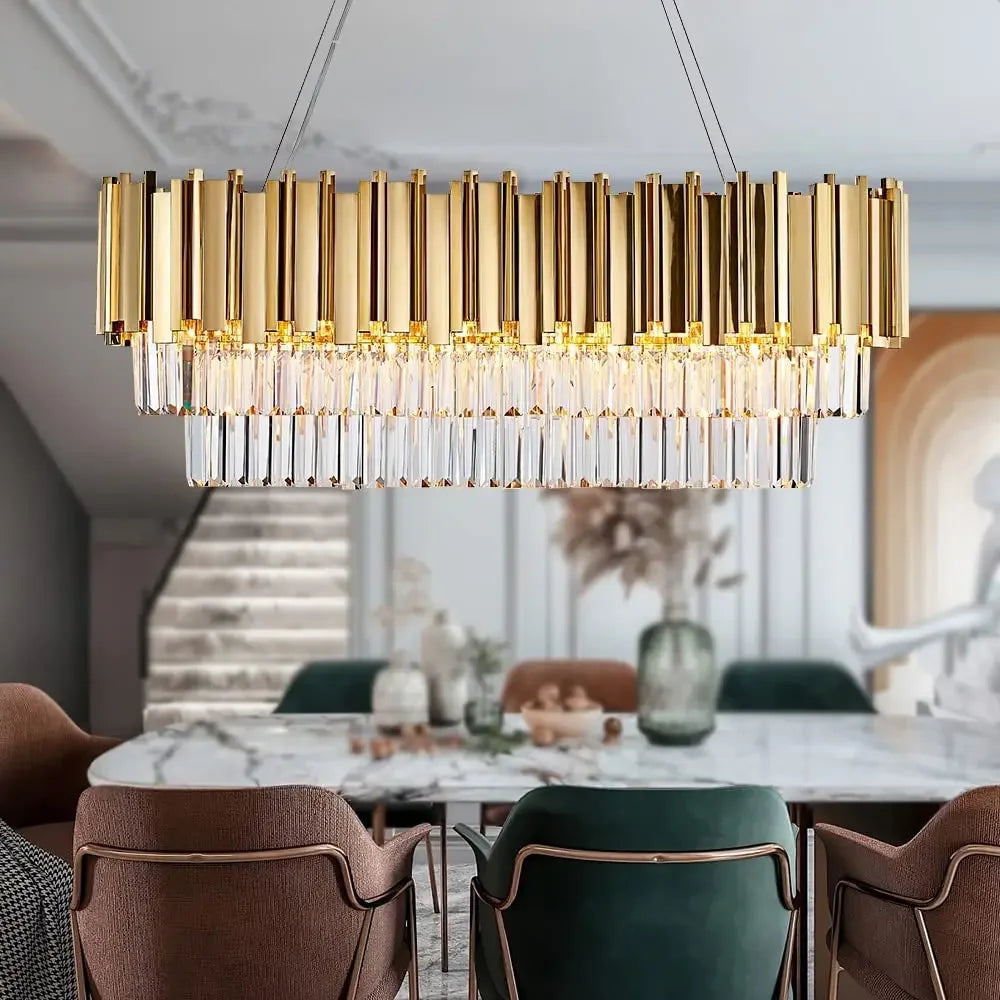 Luxury gold crystal chandelier for dining room and kitchen island, featuring elegant oval pendant lights and intricate crystal details.