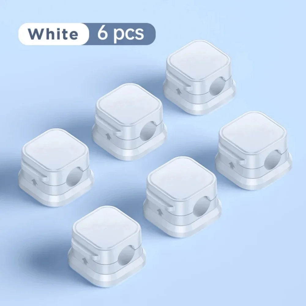 Showlu Smart General magnetic cable clips organizer holding and managing charging cables on a desk surface.