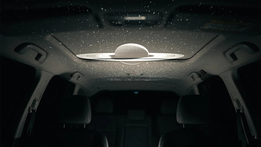 Showlu Smart General Car LED Roof Star Light illuminating a vehicle interior with a starry sky effect.