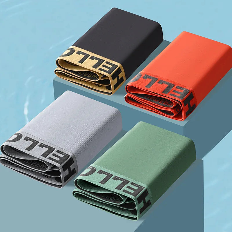 Showlu men's ice silk boxer shorts in a 4-pack, breathable and comfortable underwear in size L to 6XL, displayed in a retail setting.