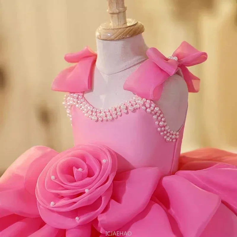 Pink princess birthday dress for girls by Showlu Fashion, featuring floral details, suitable for first birthdays, parties, and performances.