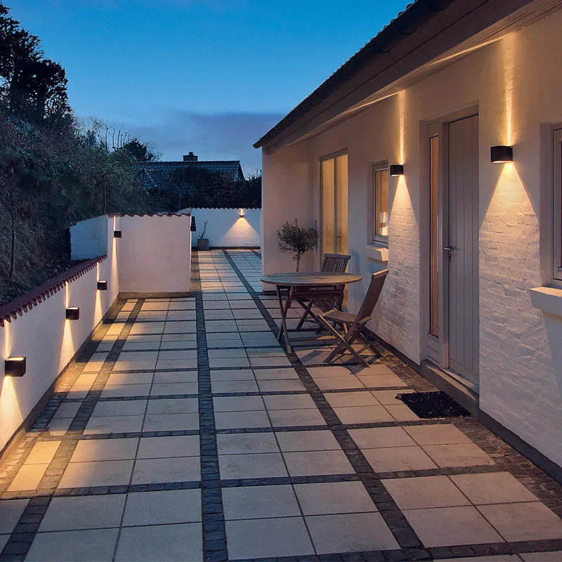 Showlu Smart waterproof LED wall light, 6W or 12W IP65 rated outdoor lighting fixture mounted on a wall.