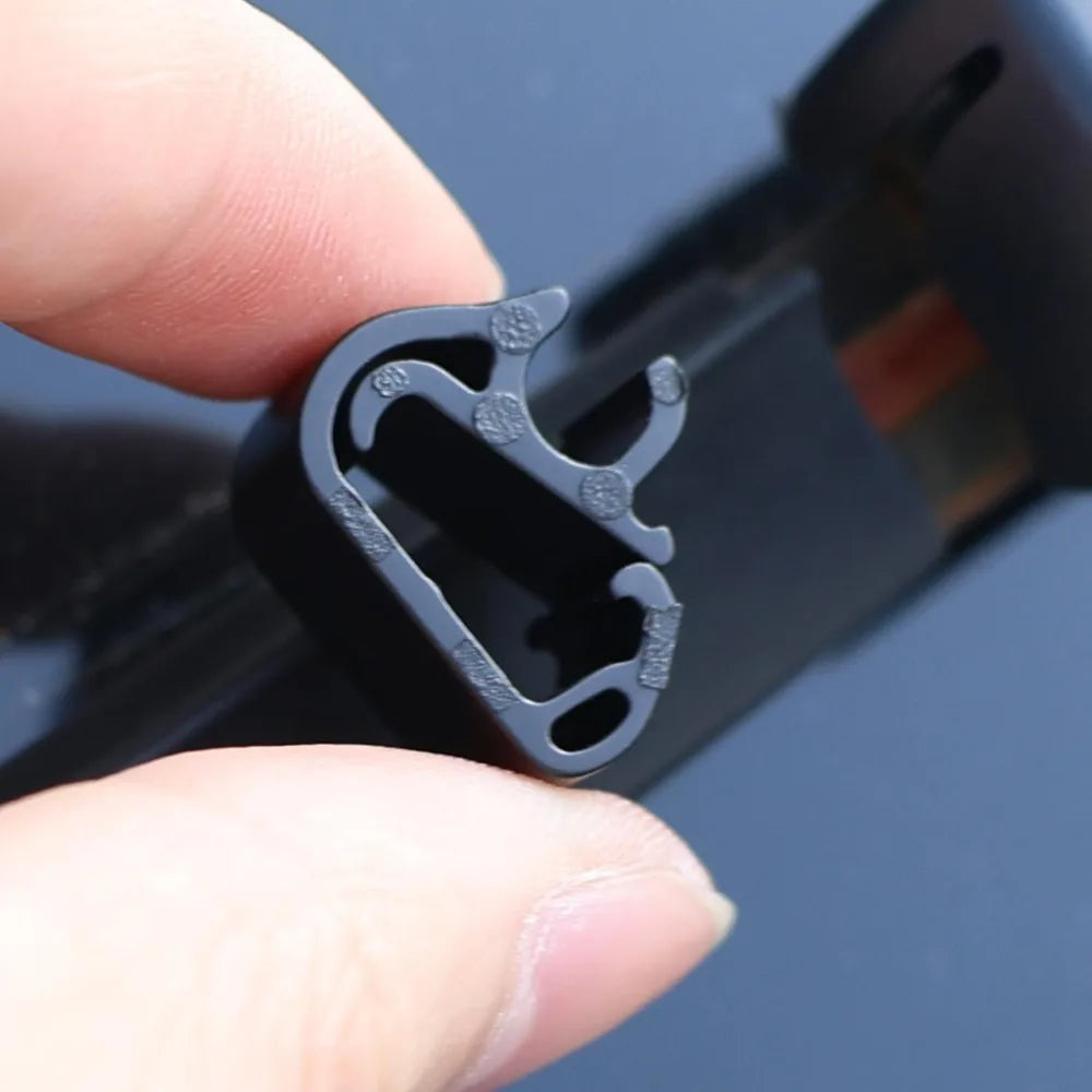 Showlu Fashion Store nozzle holder clip attached to a garden hose, showing its durable plastic design for secure attachment.