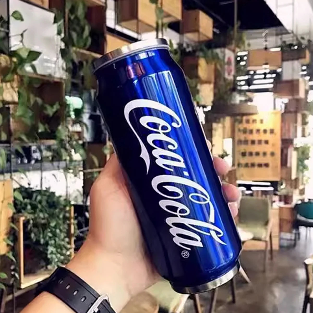 Stainless steel Coca-Cola mug by Showlu Fashion Store, insulated drinking cup with a Coca-Cola logo design and durable construction.