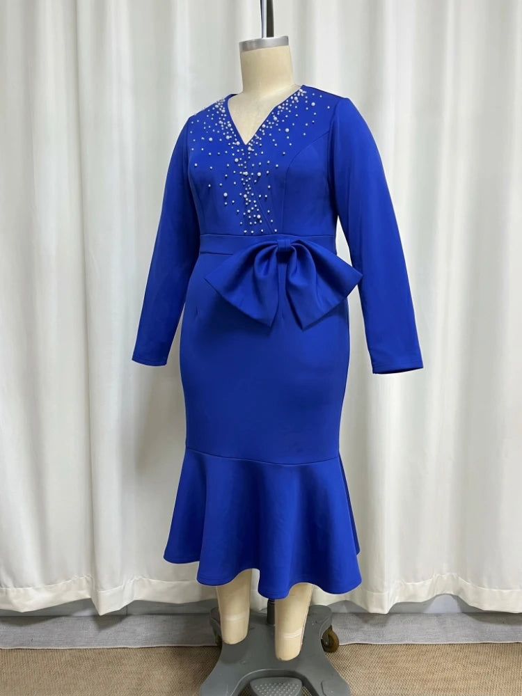 Elegant women’s mermaid dress by Showlu Smart featuring beading, V-neck, long sleeves, peplum, bow waist, suitable for weddings and formal events.