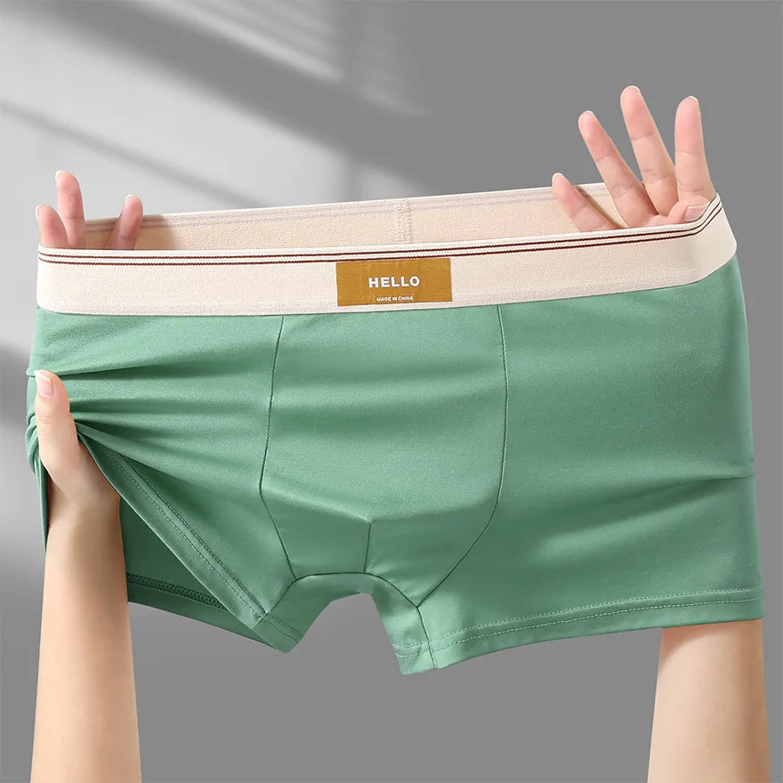 Breathable men's boxer shorts made of milk silk, featuring a comfortable fit and sexy design for everyday wear.