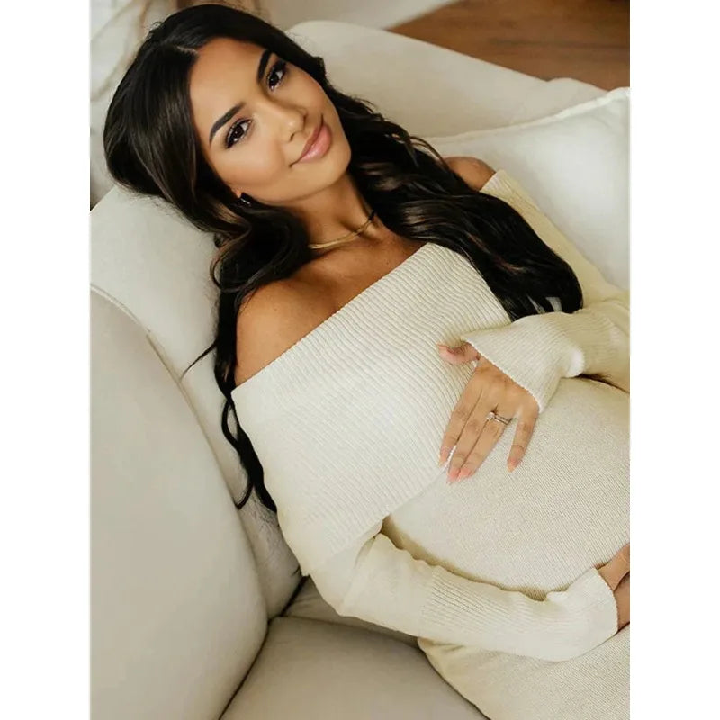 White off-shoulder knit maternity dress from Showlu Fashion Store, perfect for pregnancy photoshoots, featuring a soft, fitted design.