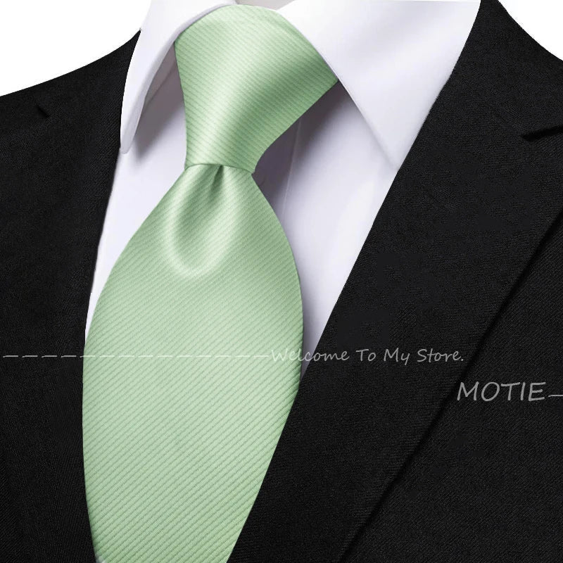 Men's solid sage green tie set with pocket square, flower brooch, cufflinks, and collar accessory for wedding or daily wear.