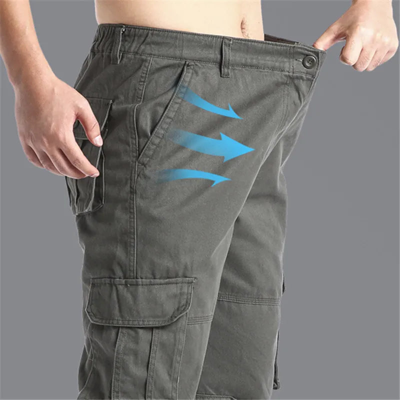 Men's cotton cargo pants by SHOWLU FASHION STORE, loose fit tactical jogging overalls with multiple pockets and durable fabric.