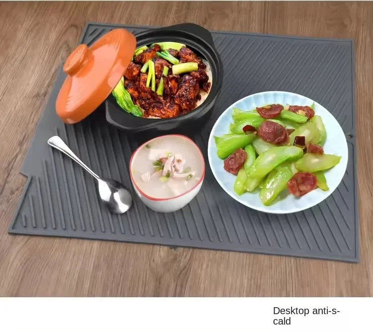 Showlu Smart General silicone sink protector mat with raised edges and drainage holes for protecting sink surfaces.