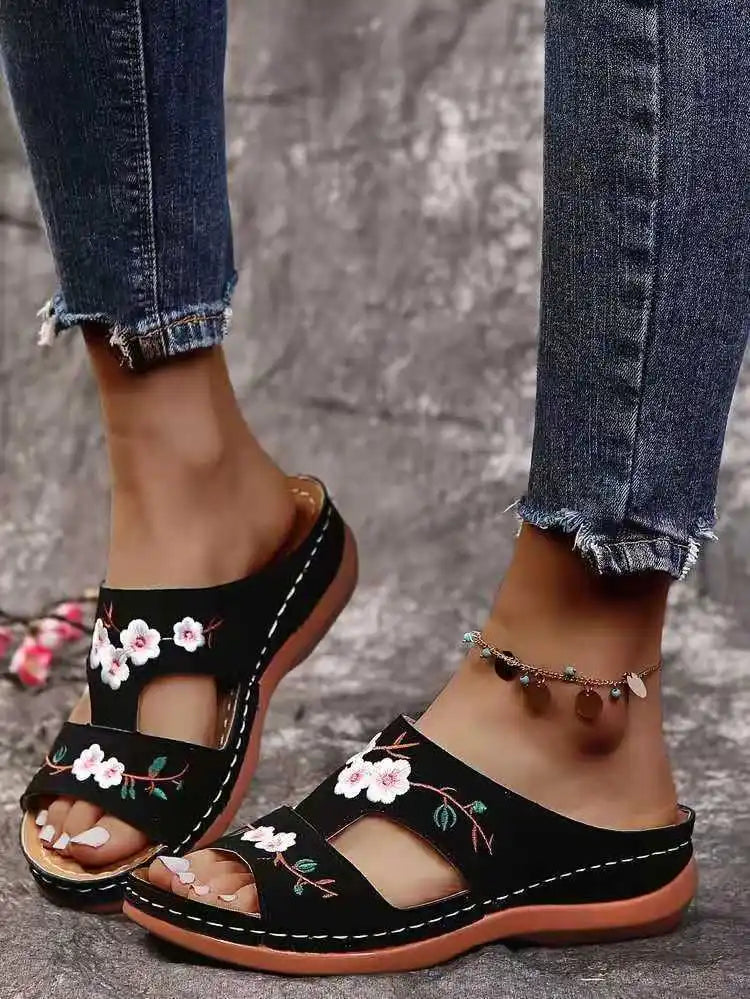 SHOWLU Women's embroidered flower leather wedge sandals with summer-style design and floral embellishments.