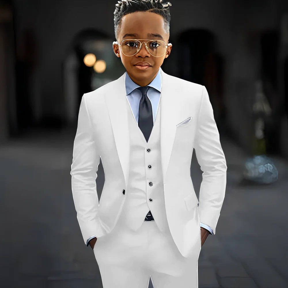 Dark grey boys' suit by Showlu Fashion featuring a slim fit, single-breasted jacket, pants, and vest with peak lapels.