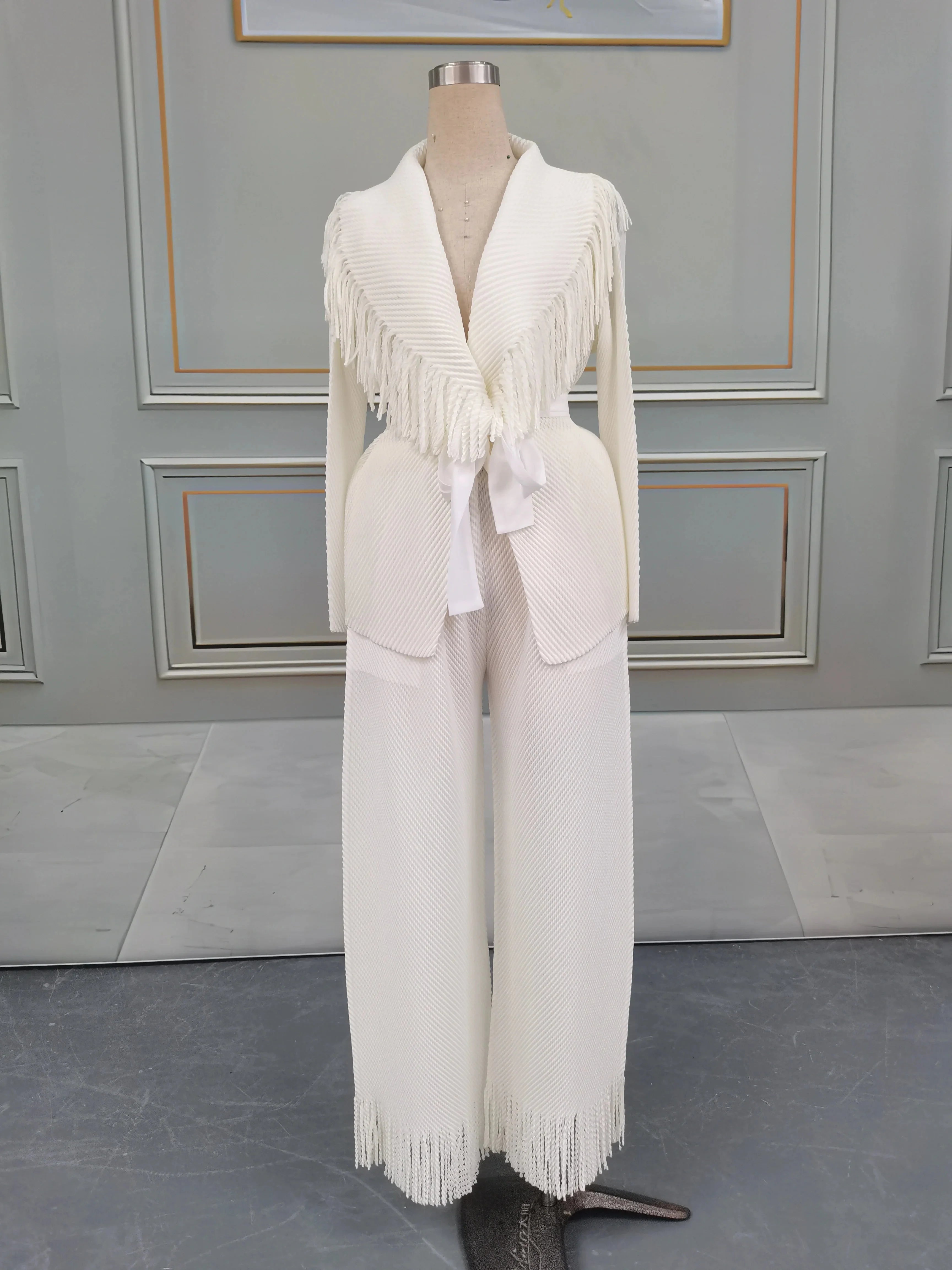 Miyake Folds women's fringe lapel coat and straight skirt two-piece set, shown in dark fabric, with stylish design details.