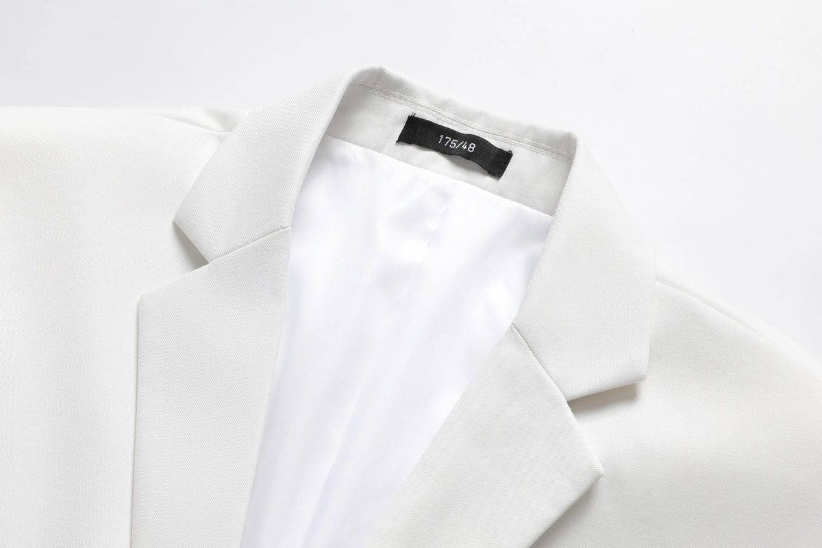 Showlu Fashion Men's white 3-piece slim fit suit, anti-wrinkle business formal with jacket, vest, and trousers, displayed on a hanger.