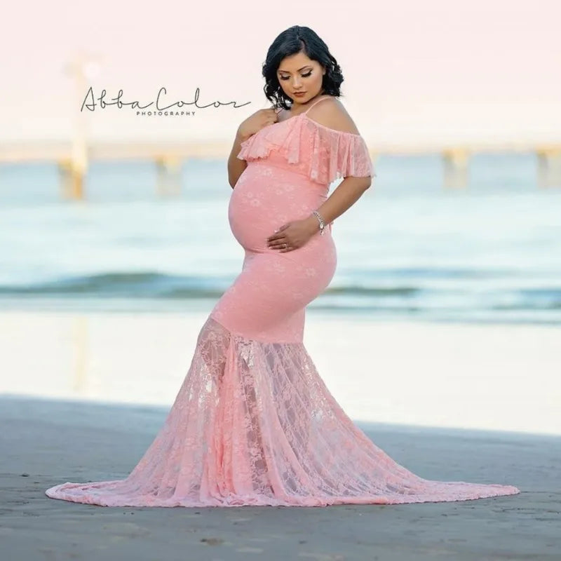 Pregnant woman in Showlu Fashion long sleeve lace Christmas dress, maternity photo shoot, festive pregnancy photography attire.