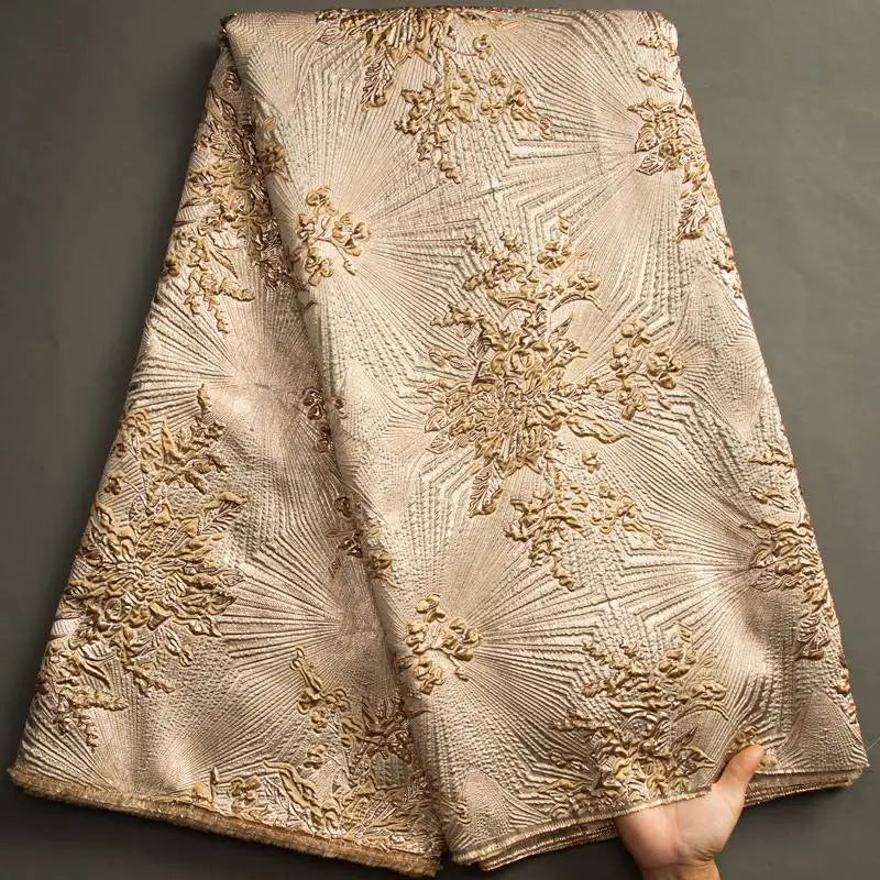 Nigerian Damask tulle fabric with floral brocade jacquard lace pattern in vibrant colors, suitable for elegant dressmaking.