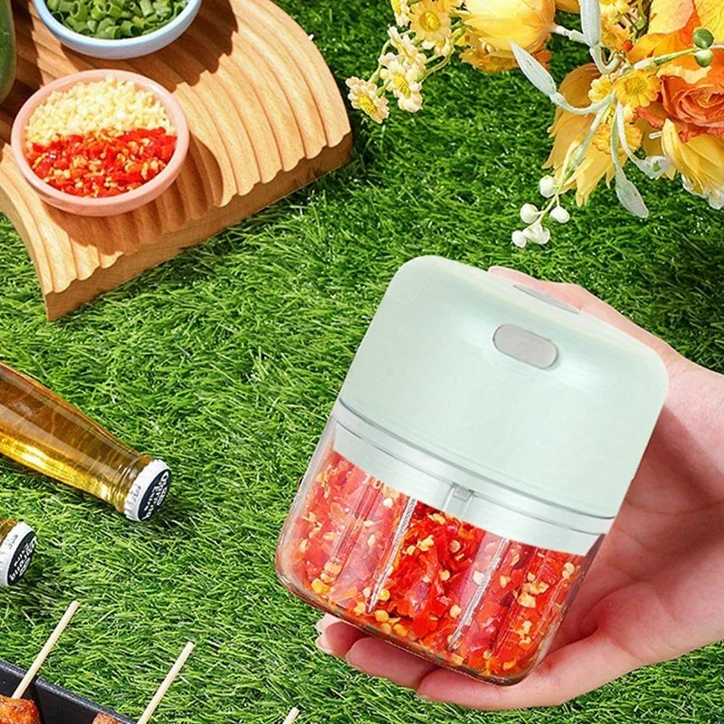 Showlu Smart General Mini Electric Garlic Grinder with stainless steel grinding chamber and compact design for easy use.
