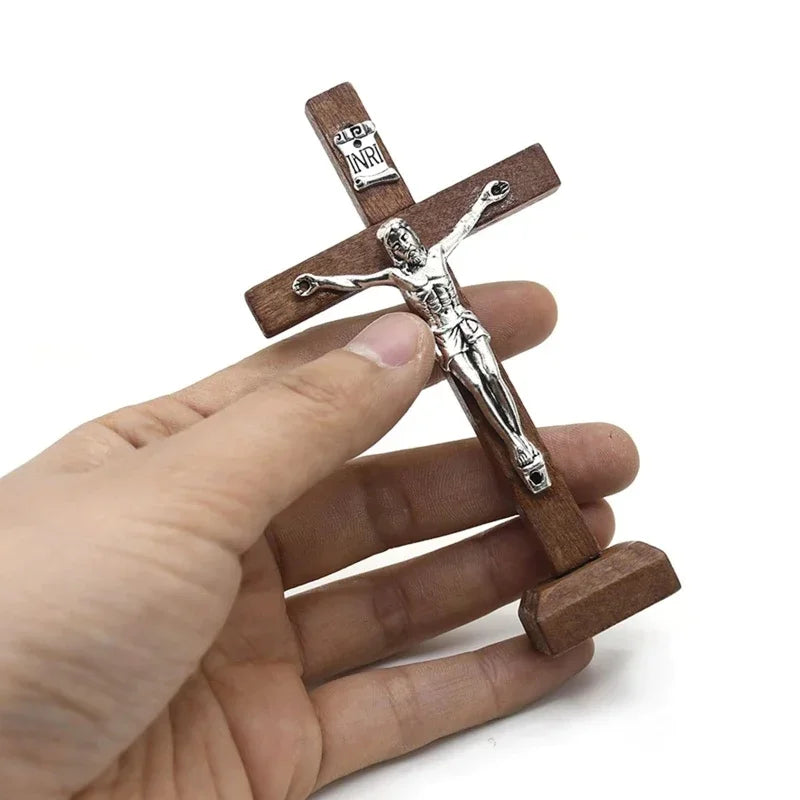 Wooden Catholic Jesus cross with stand, vintage religious Christian crucifix for church or home tabletop decor.