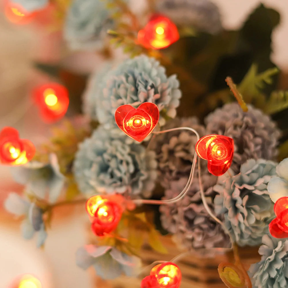 Red heart-shaped LED string lights with 20/30 bulbs, ideal for Valentine's Day, Christmas, and romantic decor.