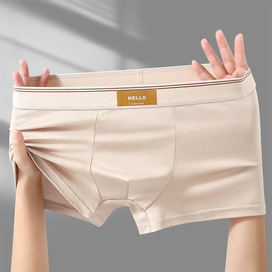 Breathable men's boxer shorts made of milk silk, featuring comfortable fit and sexy style, in classic boxers design.