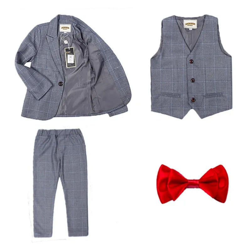 Dark green boys' formal wedding suit and tuxedo set by SHOWLU FASHION STORE, includes jacket, pants, vest, and shirt.
