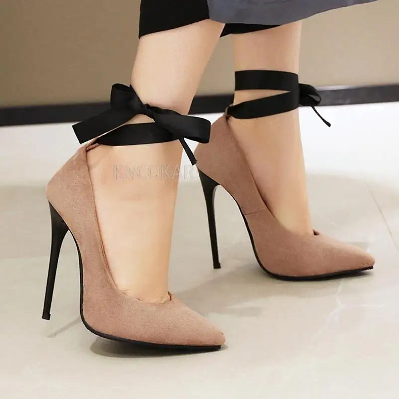 KNCOKAR women's pointed toe pumps with 12cm high heels, stylish party shoes in black, featuring sleek design and thin stiletto heels.