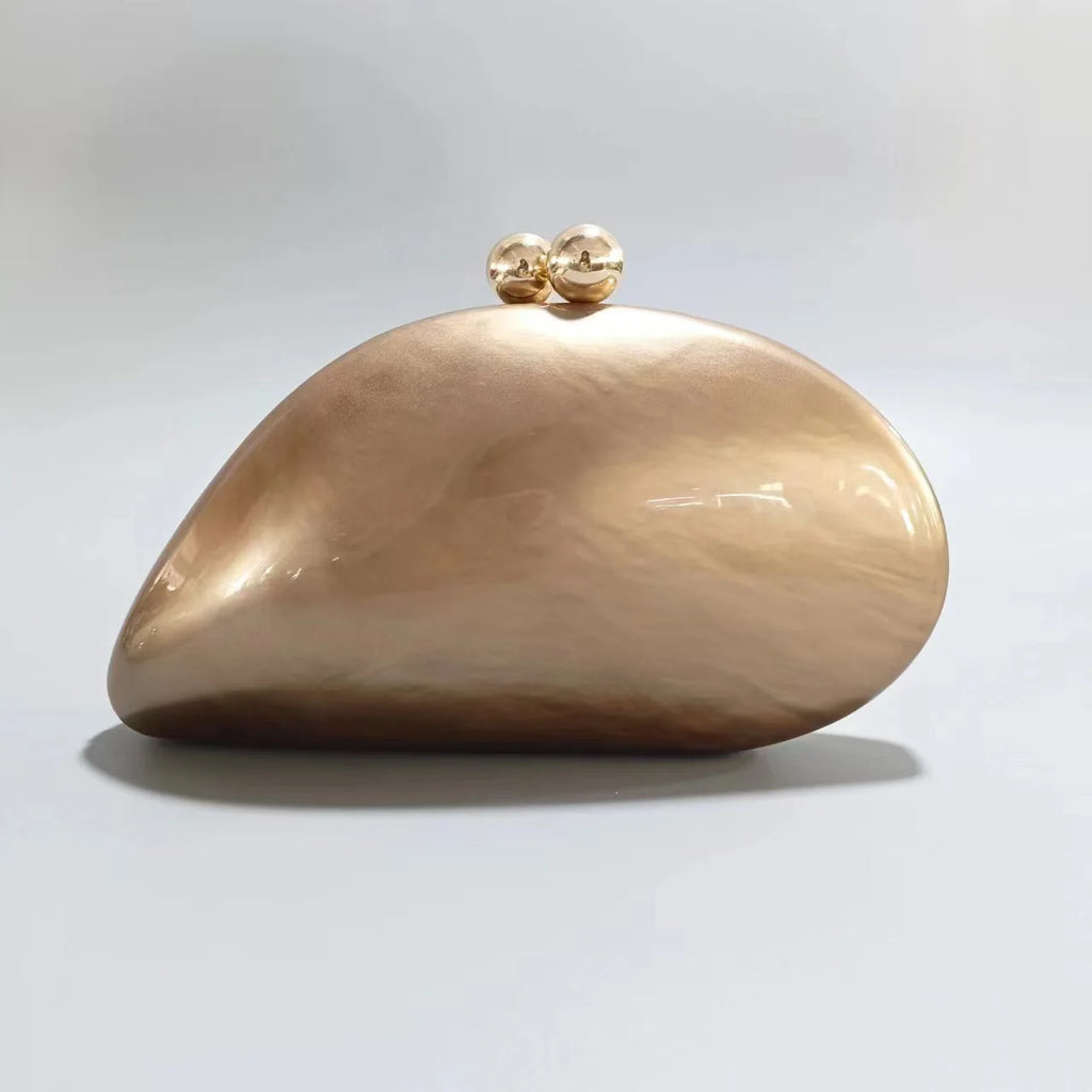 Blue acrylic shell-shaped clutch bag for women, designer evening purse with pearl accents, perfect for parties and special occasions.