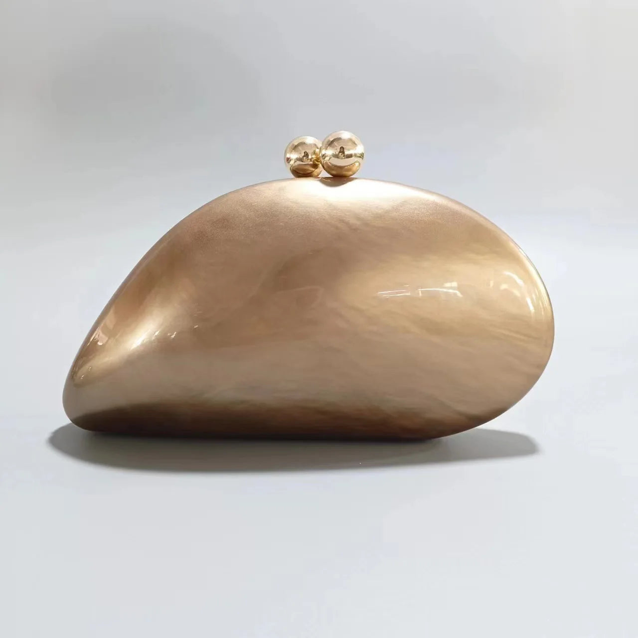 Blue acrylic shell-shaped clutch bag for women, designer evening purse with pearl accents, perfect for parties and special occasions.