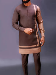 A man wearing a brown long-sleeved tunic with tan accents and matching trousers.