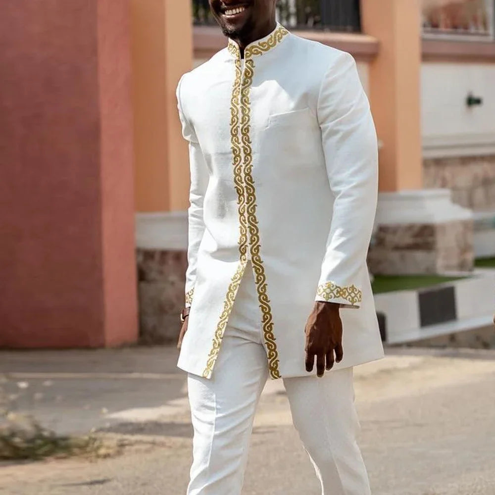 White Showlu Men's Kaunda suit, traditional African 2-piece cotton set featuring intricate embroidery and a classic fit.