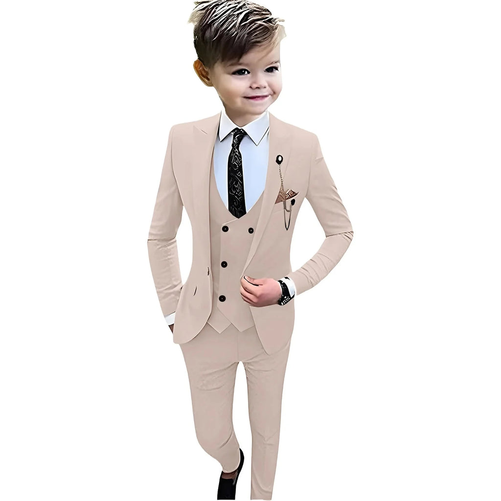 Beige boys' formal suit set by SHOWLU FASHION STORE, includes tuxedo jacket, vest, pants, and shirt for weddings and special occasions.