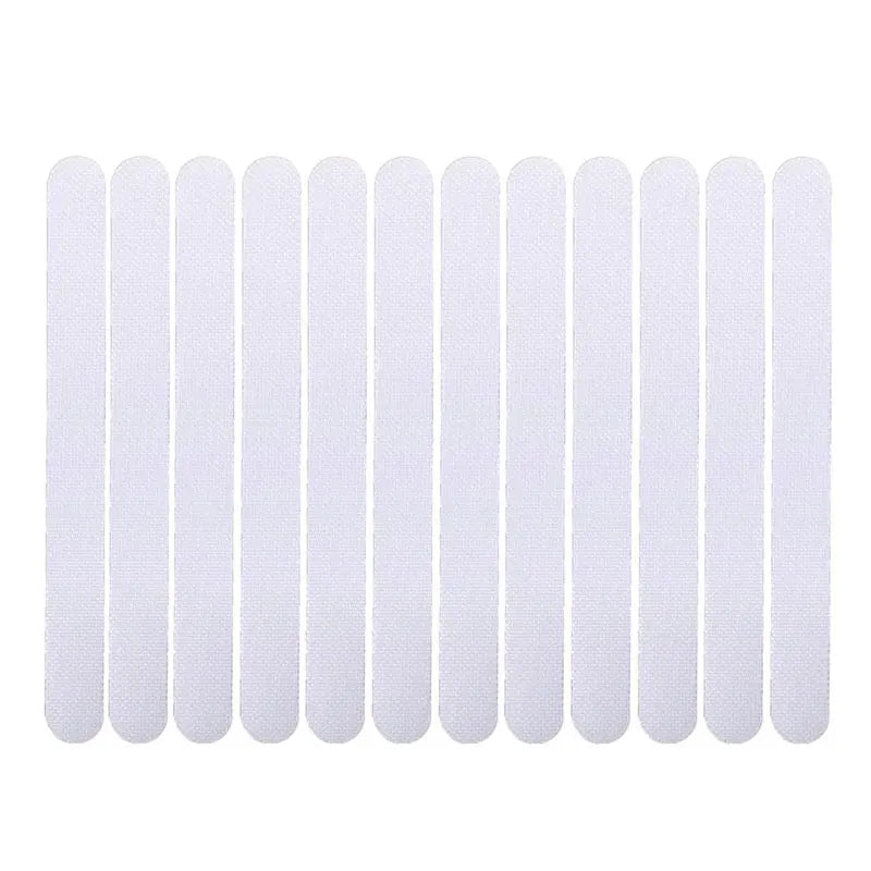 Showlu Smart General anti-slip shower stickers on a bathroom floor for safety and grip in wet conditions.