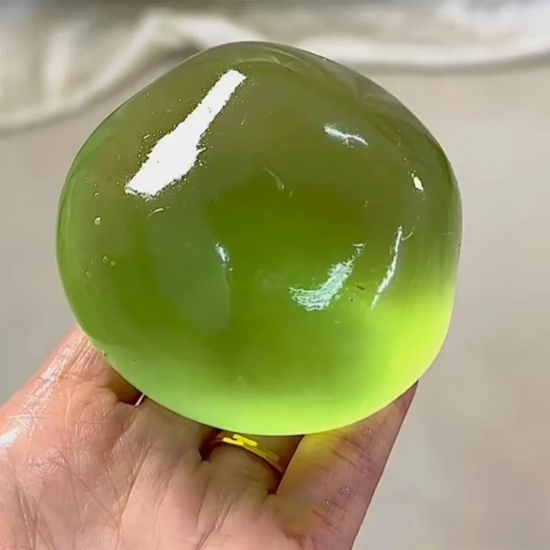 Transparent squishy maltose stress ball from Showlu Fashion Store, slow-rise sensory ball for hand exercise and stress relief.