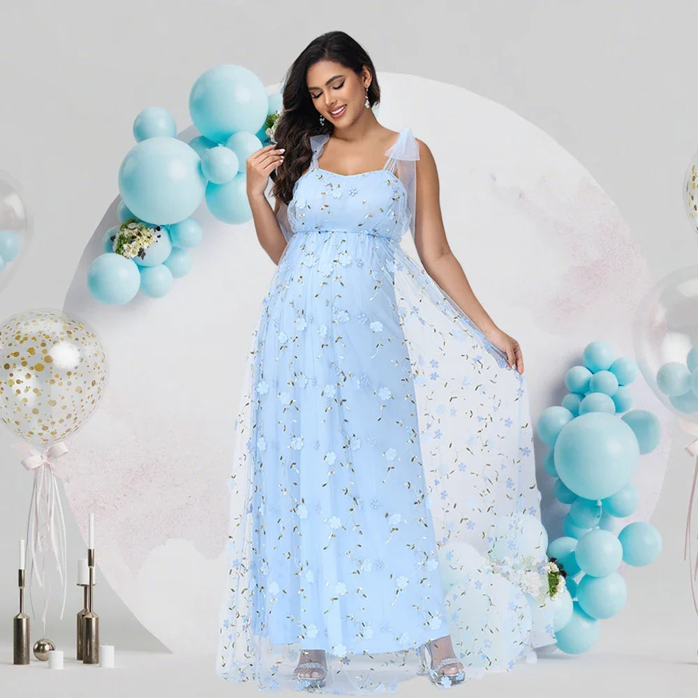 Showlu maternity tulle gown with floral embroidery and V-neck, ideal for photoshoots, featuring a flowing, elegant design.