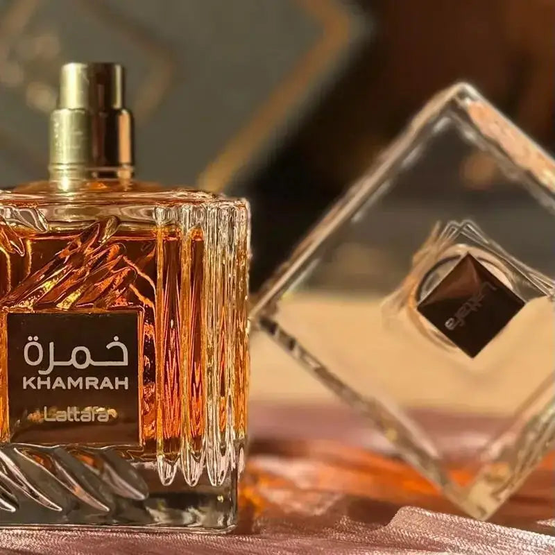 Lattafa Khamrah unisex perfume spray featuring warm vanilla and cinnamon in a 100ml bottle, shown in the image.