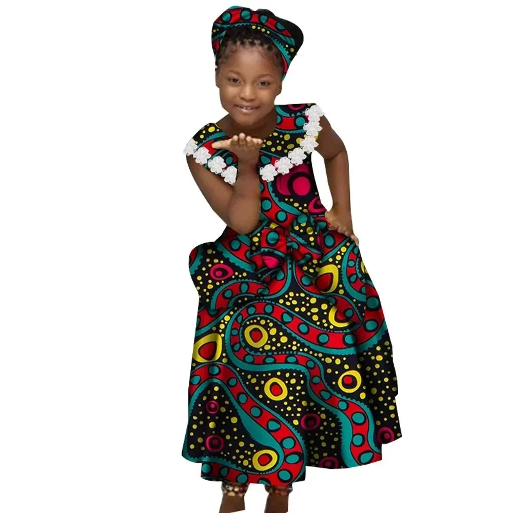 African Ankara print girl's dress with cotton Kente pleated skirt, featuring vibrant colorful patterns and a comfortable fit.