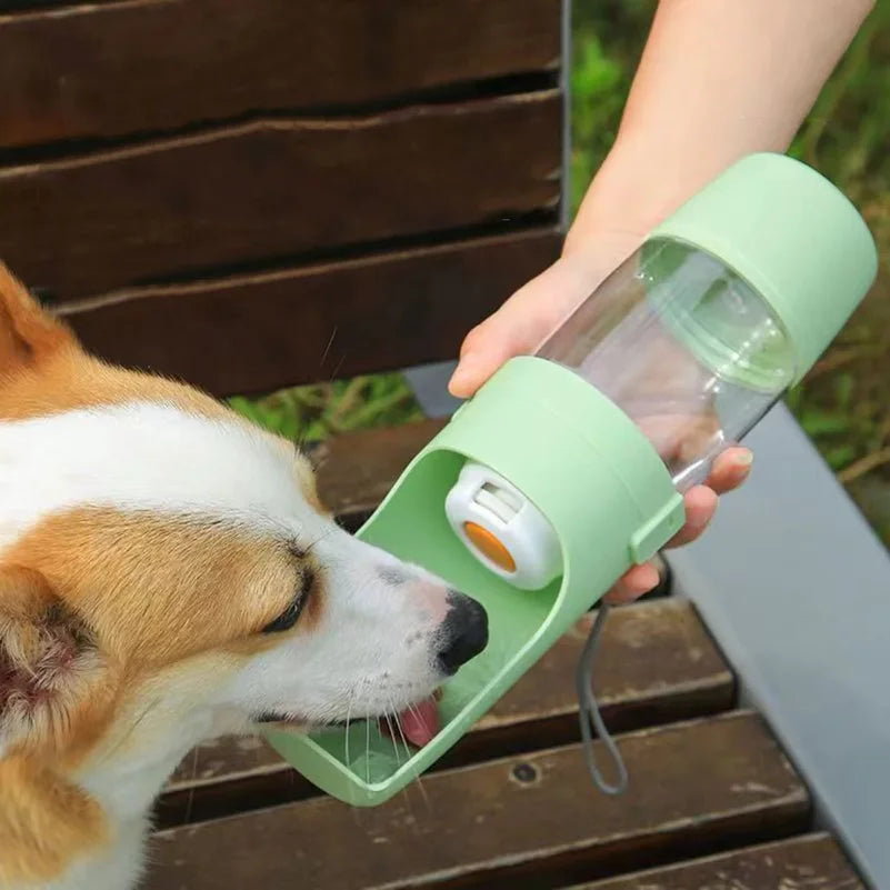 Showlu portable dog water bottle and food container, 500ml travel pet feeder with spill-proof design and compact carry handle.