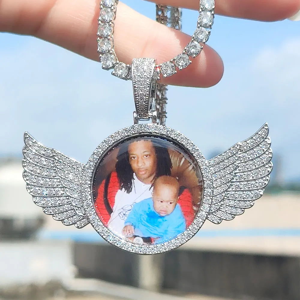 Custom angel wing round pendant necklace with personalized photo charm and tennis chain, suitable for men and women.