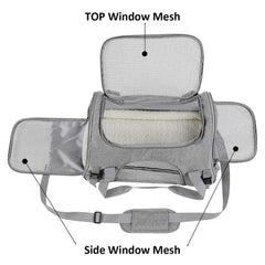 A grey soft-sided pet carrier with mesh windows on the top and both sides and a plush interior.