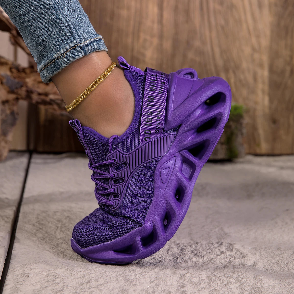Purple women's sneakers with cushioned EVA soles, featuring a stylish blade design and anti-slip lightweight running shoes.