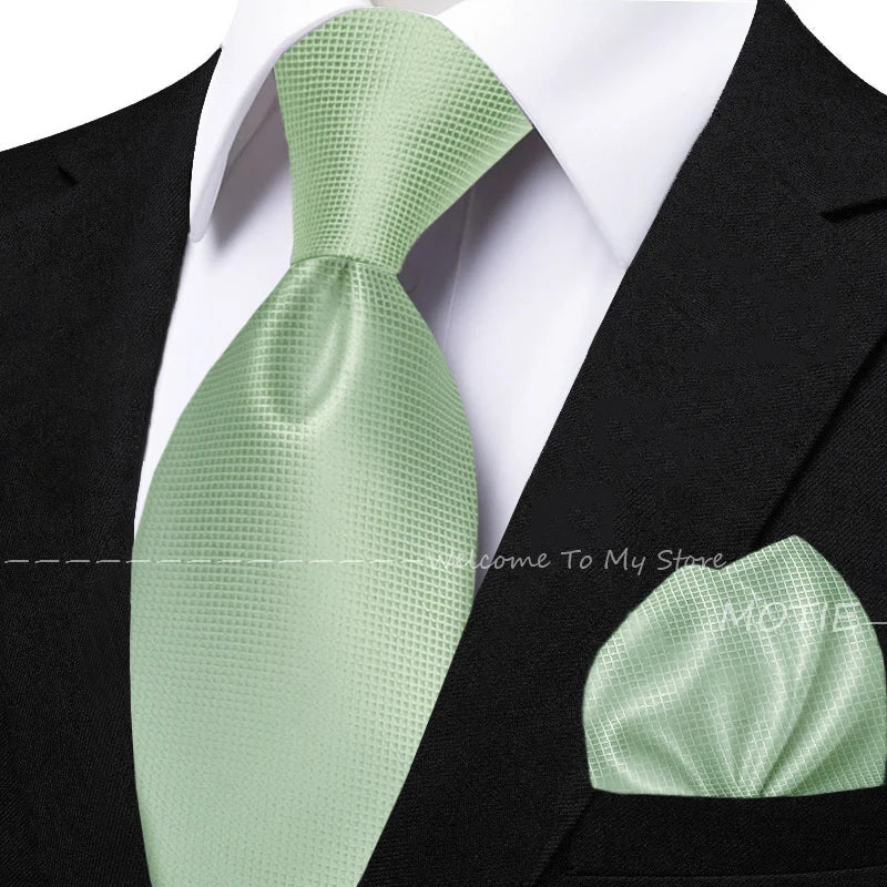 Men's solid green tie set with pocket square, flower brooch, cufflinks, and collar accessory for wedding or daily wear.