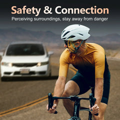 A cyclist wears Ortizan open-ear wireless headphones while riding on a road.