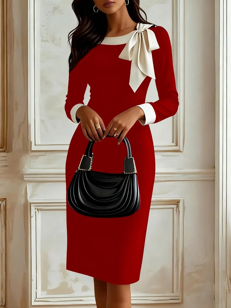 Color-blocked Showlu Women's career dress with bow tie detail, autumn pencil style, shown on a model with a stylish professional look.
