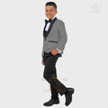 Boy's formal tuxedo suit by SHOWLU FASHION STORE featuring a white jacket, vest, and pants for special occasions.