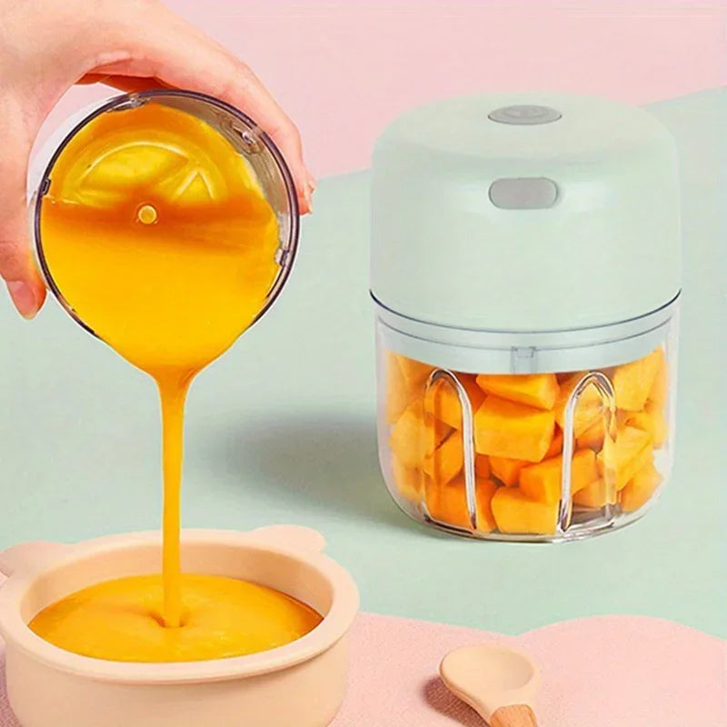 Mini electric garlic grinder by Showlu Smart General, showing the compact stainless steel grinder with garlic inside.