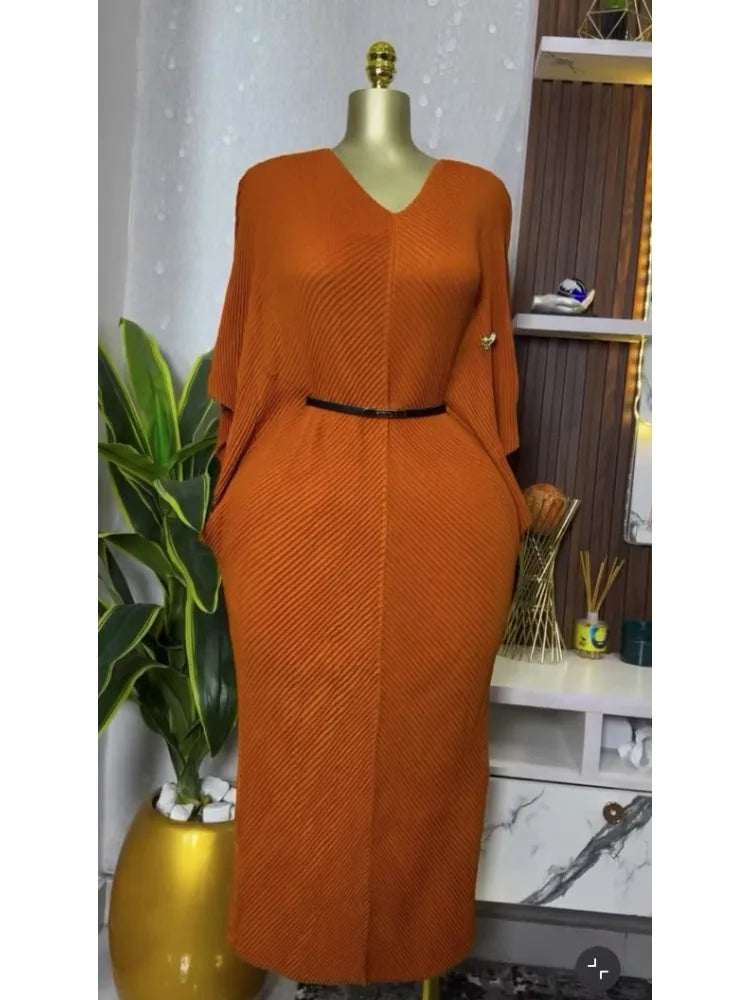 Miyake pleated V-neck lace-up dress with bat sleeves, showing a slim fit and elegant design for women's spring fashion 2025.