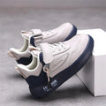 White leather kids' sneakers by SHOWLU FASHION STORE, breathable unisex casual sports shoes with comfortable design.