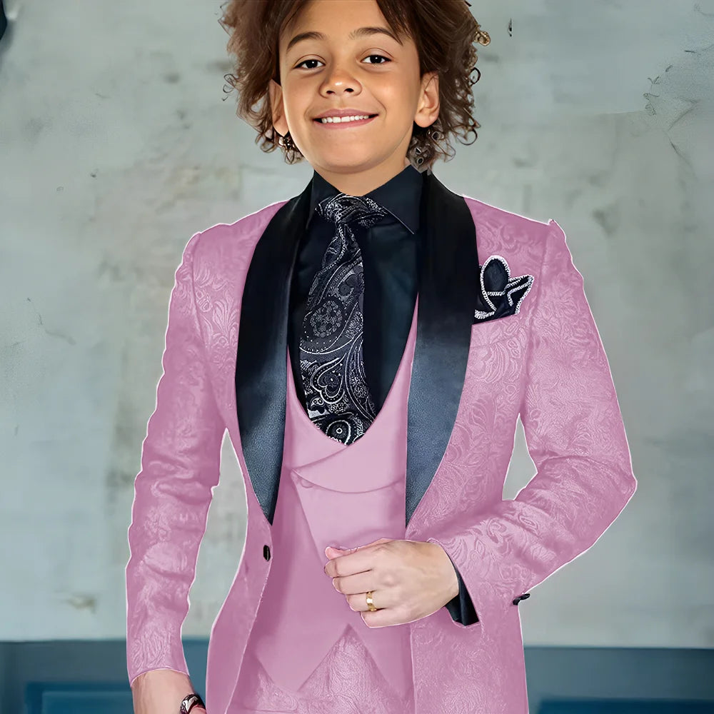 Burgundy jacquard boys' 3-piece suit with jacket, pants, and vest, suitable for formal occasions and weddings.